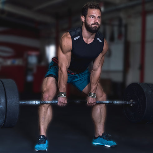 Man doing deadlifts, wearing grey Wrist Strap