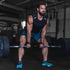 Man performing a deadlift, wearing wrist straps - AQF Sports