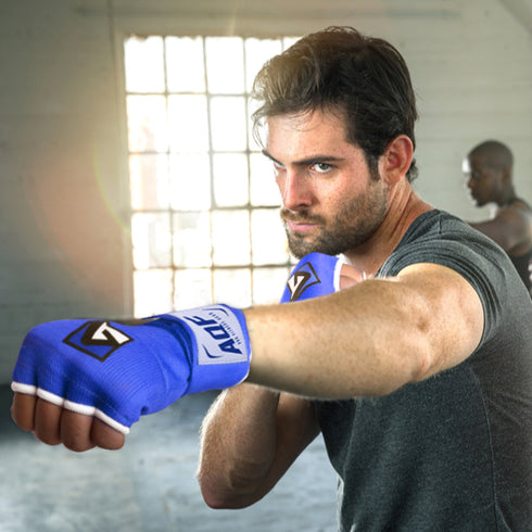 Man Wearing Blue Wrist Wrap - AQF Sports